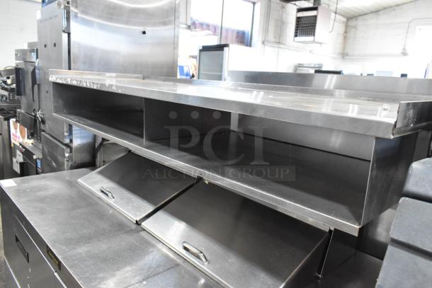 Delfield stainless steel sandwich salad prep table with Bain Marie mega top, 4 drawers, and overhead shelf. 115 volts, 1 phase.