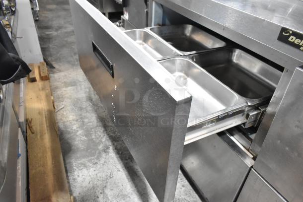 Delfield stainless steel prep table with 4 drawers, bain marie, mega top, and overshelf. Commercial grade, 115 volts, 1 phase.