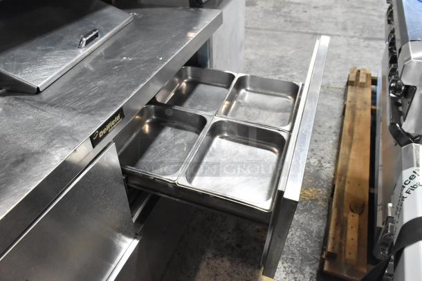 Delfield stainless steel commercial prep table with 4 drawers, overshelf, and Bain Marie top. 115 volts, 1 phase.