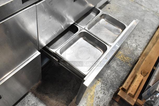 Delfield stainless steel commercial prep table with four drawers, bain marie top, and over shelf. 115 volts, 1 phase.