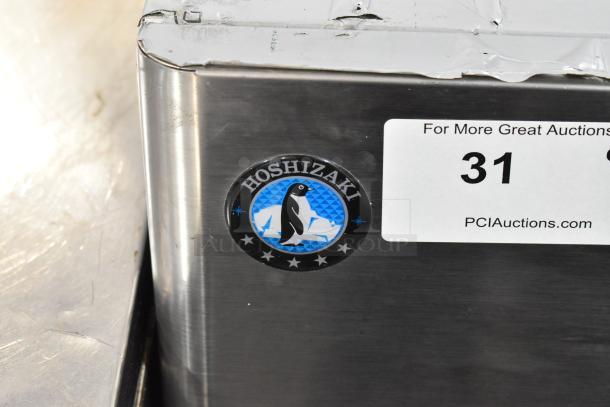Hoshizaki DCM-500BAH stainless steel commercial ice machine with water dispenser. Includes logo and auction label.