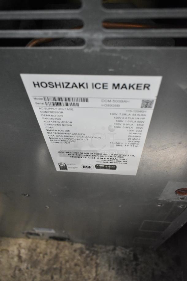 Hoshizaki DCM-500BAH stainless steel ice machine with water dispenser label, showing model and specifications.