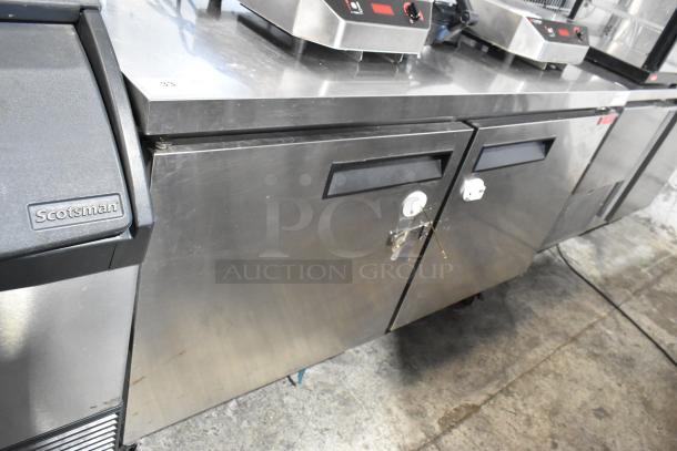 L&J NY JUC-60 stainless steel 2-door undercounter cooler, on commercial casters, 115 volts, 1 phase, with visible handles.