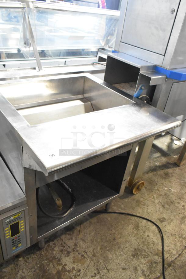 Stainless steel commercial steam table with sneeze guard, electric powered, includes digital controls, Subway branding visible.