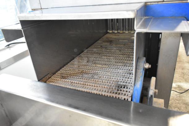 Pokomat P16/320 SI metal brine meat injection machine, commercial floor style, on casters, 220V, interior view.