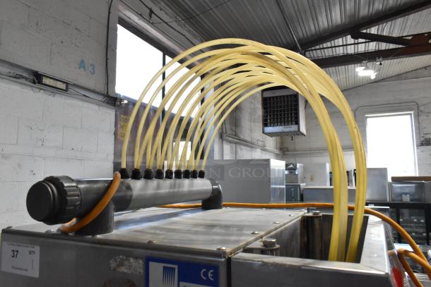 Pokomat P16/320 SI metal brine meat injection machine, on casters, 220V, featuring multiple yellow hoses and CE marking.