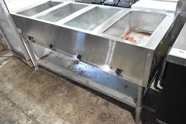 Adcraft ST-240/4 stainless steel commercial steam table with 4 bays, electric powered, 208/240 volts, used condition.