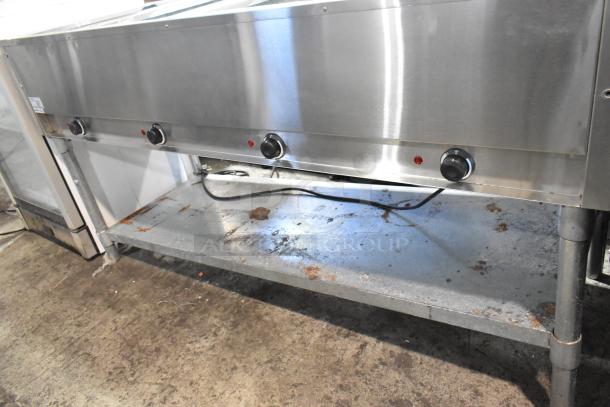 Adcraft ST-240/4 Stainless Steel 4 Bay Steam Table, electric, 208/240V, visible wear on base, commercial kitchen use.