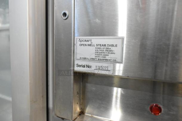 Adcraft ST-240/4 stainless steel 4-bay steam table, 208/240V, open well design, label showing model and serial number.