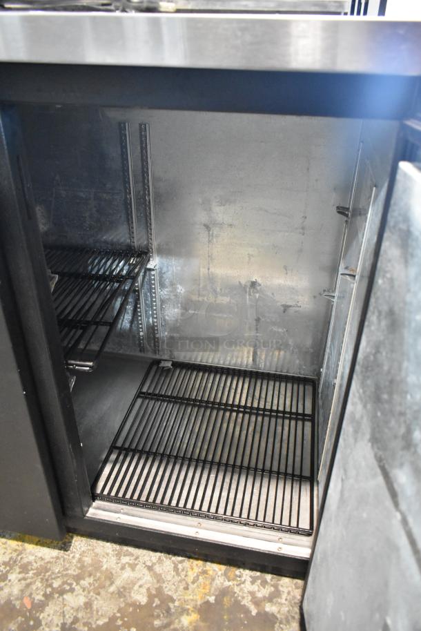 True TBB-24-48 metal commercial 2-door undercounter cooler, 115 volts, 1 phase, interior view showing metal shelves.