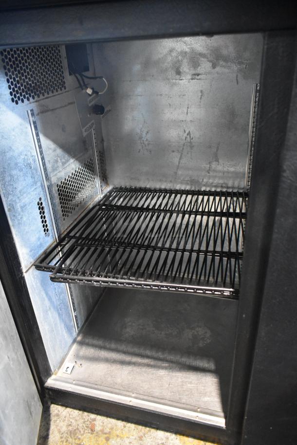 True TBB-24-48 metal undercounter cooler, 2 doors, 115 volts, with wire shelves, in used condition.