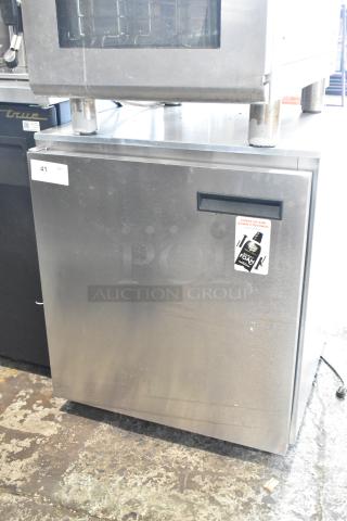 Delfield 406CA-DHL-DD1 stainless steel undercounter cooler, single door, commercial-grade, 115V, some surface wear visible.