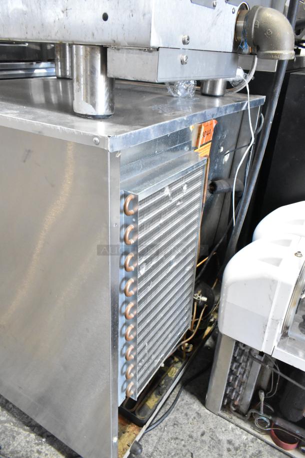 Delfield 406CA-DHL-DD1 stainless steel undercounter cooler, single door, 115 volts, 1 phase, visible worn condition.