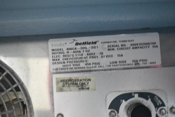 Delfield 406CA-DHL-DD1 stainless steel undercounter cooler, commercial, single door, 115V, label shows specs and model info.