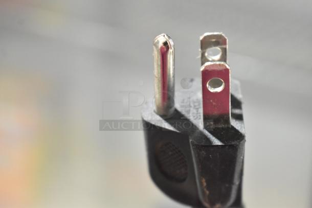 Close-up of a three-prong plug for the BBC138 Metal Mini Cooler Merchandiser, 115 Volts, 1 Phase.