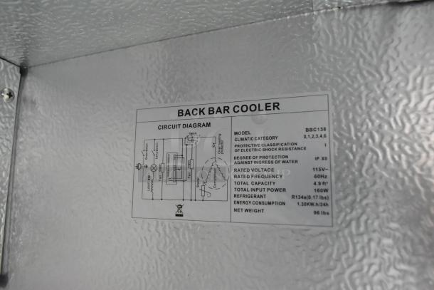 Metal mini cooler merchandiser, model BBC138. Features 115V operation, 60Hz frequency, and 4.9 ft³ capacity. Circuit diagram visible.