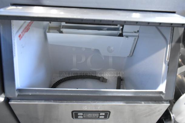 2023 Vremi stainless steel undercounter ice machine, self-contained. Visible controls, good condition, 115V, 1 phase.