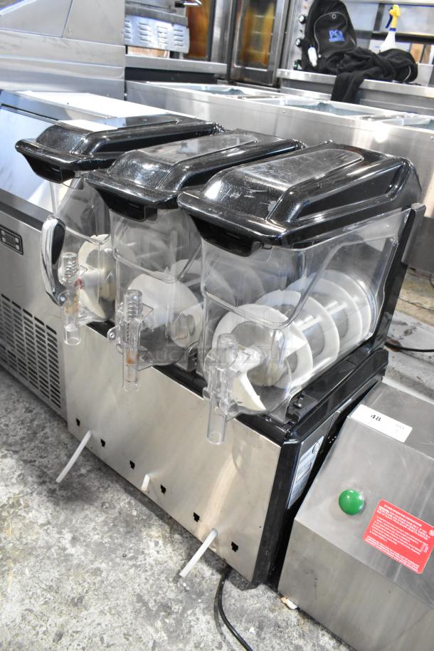 Metal commercial countertop slushie machine with 3 hoppers, 115 volts, 1 phase. Durable stainless steel, good condition.