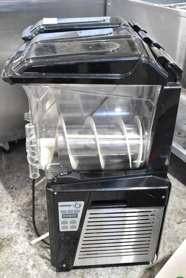 Metal commercial slushie machine with 3 hoppers, 115 volts, 1 phase. Features control panel, in good condition.