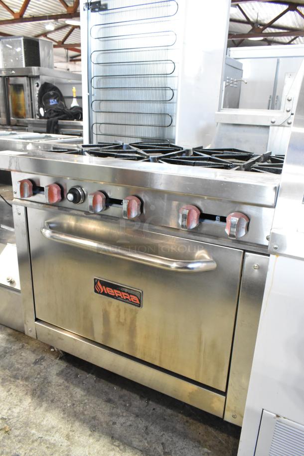 Sierra stainless steel 6-burner gas range with oven, on commercial casters. Features robust knobs, clean surface, visible branding.