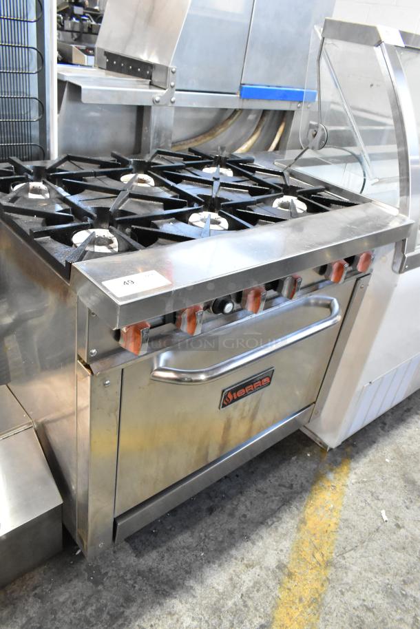 Sierra stainless steel 6 burner commercial gas range with oven, on casters. Features red control knobs and brand logo.