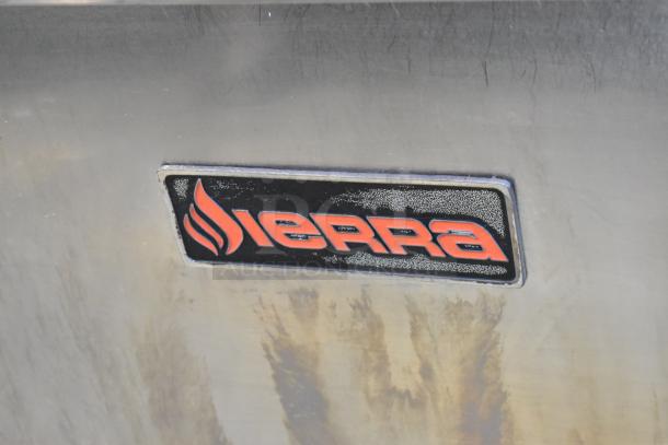 Sierra logo on stainless steel, indicating a commercial gas-powered 6 burner range with oven, on commercial casters.