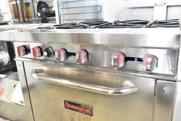 Sierra stainless steel commercial gas 6-burner range with oven, visible control knobs, on heavy-duty casters.