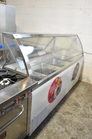 Metal commercial floor-style ice cream dipping cabinet with tub collars, 115 volts, 1 phase, used condition.