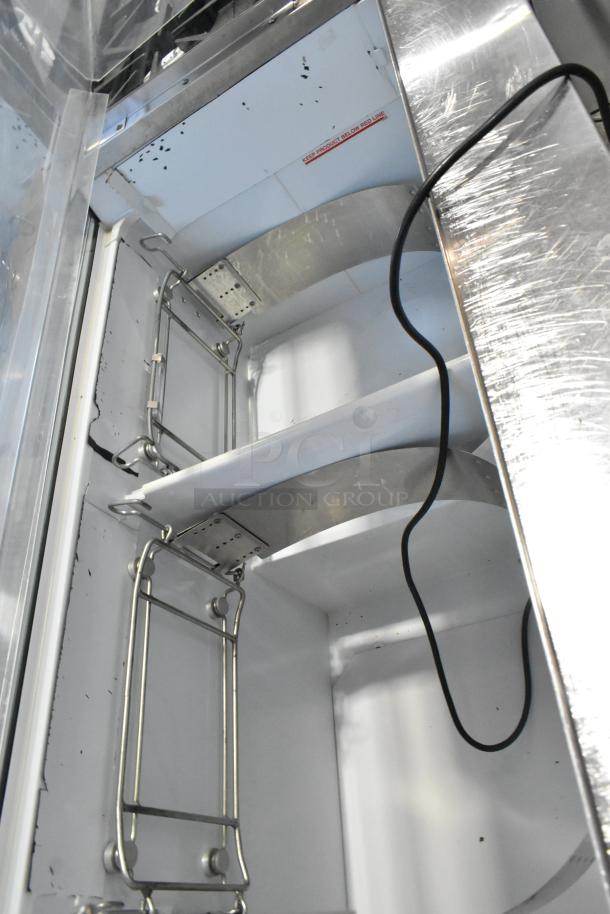 Metal commercial floor style ice cream dipping cabinet with tub collars, 115 volts, 1 phase, stainless steel interior.