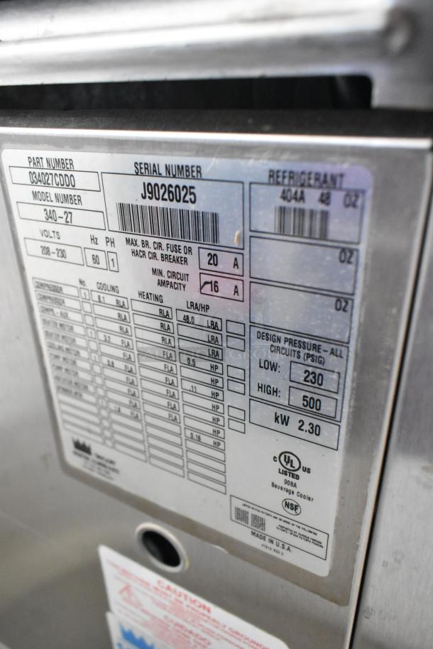 Taylor 340-27 stainless steel frozen beverage machine label showing model, serial number, and specifications. 208-230V, 1 phase.