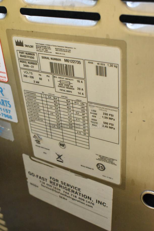 Taylor 340D-27 stainless steel frozen beverage machine label, showing model, voltage, and circuit details for buyers.
