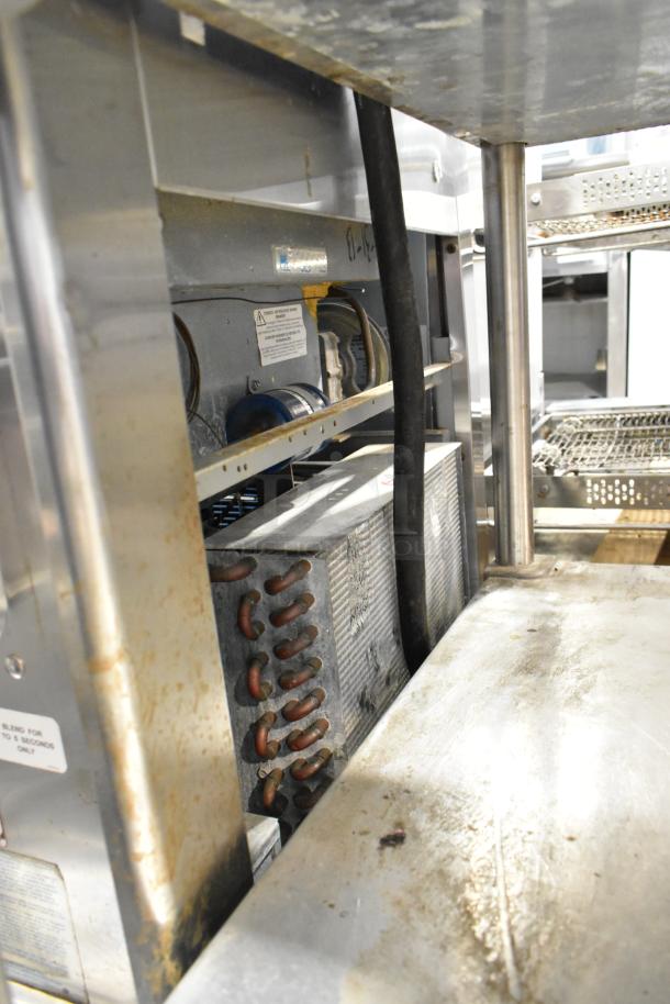 Taylor 340-27 stainless steel commercial frozen beverage machine interior, shows electrical components and visible wear.