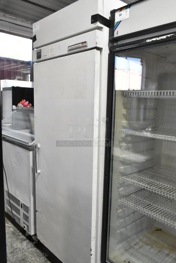 Kelvinator T3OHSP-4 commercial single door hardening cabinet with poly coated racks, 115V, 1 phase. Slight wear visible.