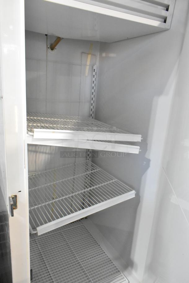 Kelvinator T3OHSP-4 commercial single door hardening cabinet with poly coated racks visible, 115V, 1 Phase.
