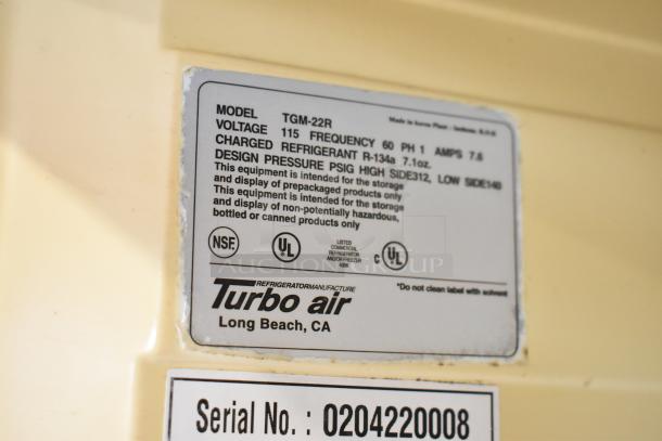 Turbo Air TGM-22R metal commercial cooler label showing model, voltage (115V), refrigerant details, and UL certification.