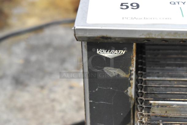 Vollrath JT1H stainless steel conveyor toaster oven, 120V, showing wear and marks. Model and brand logo visible.