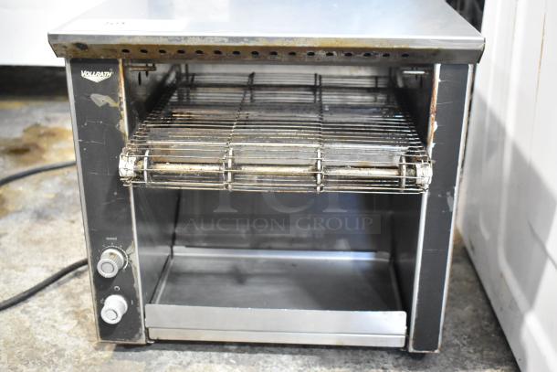 Vollrath JT1H stainless steel conveyor toaster oven, electric, 120V, 1 phase. Visible wear. Dual knobs for speed/temp control.