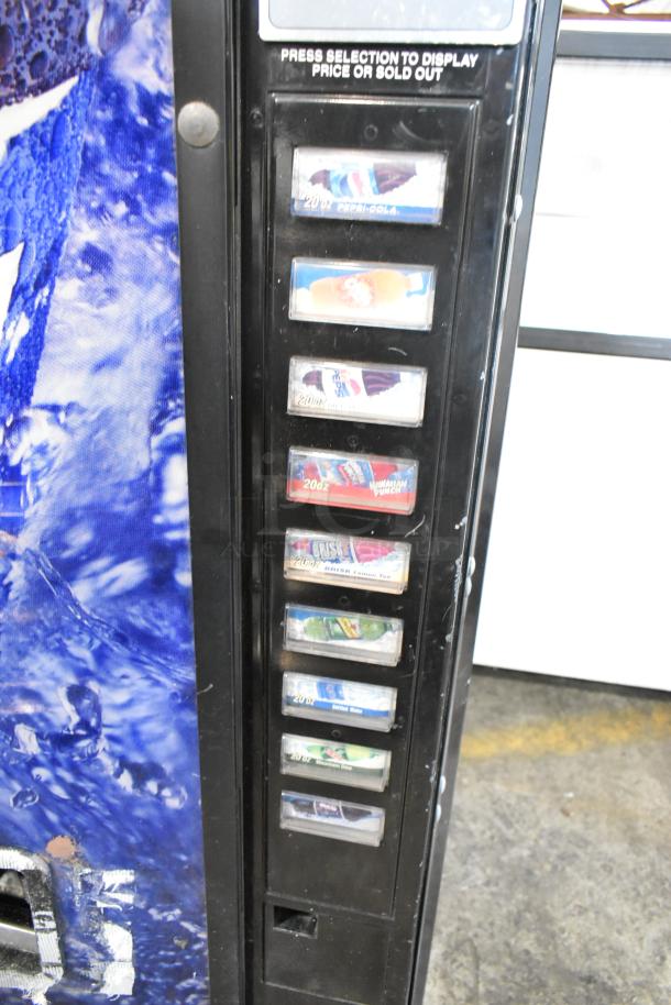 Metal commercial vending machine with bill acceptor, no key, 115 volts, 1 phase. Features beverage selection panel.