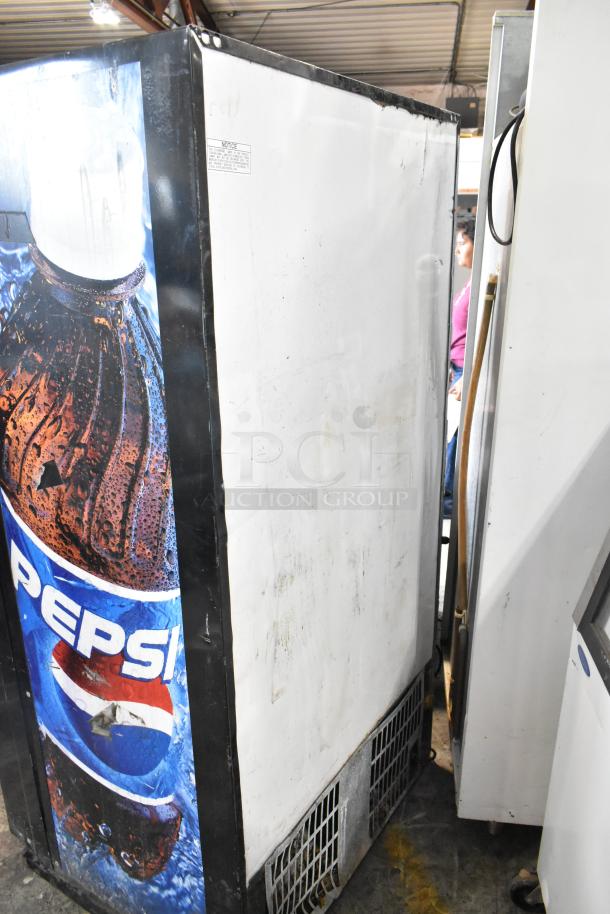 Metal commercial floor vending machine with bill acceptor, Pepsi branding. Used condition. No key included. 115V, 1 phase.