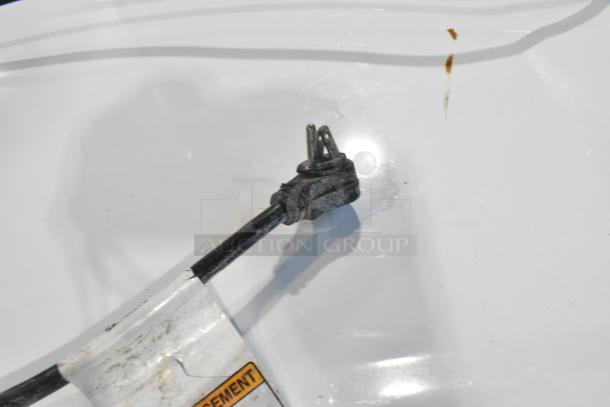Whirlpool WFW5620HW2 front load washer cord with wear; 120 volts, 1 phase, visible label.