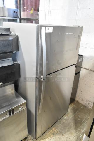 2020 Whirlpool WRT311FZDM01 stainless steel refrigerator with top freezer, 115V, 1 phase. Some surface wear visible.