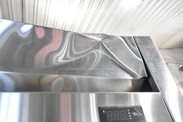 2020 True T-35-HC stainless steel cooler, visible dent on top. Digital display, poly-coated racks, 115V, 1 phase.