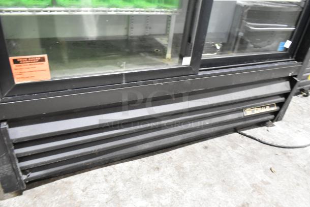 True GDM-41SL-60-LD metal commercial 2-door reach-in cooler with poly-coated racks, visible label, 115V, 1 phase.