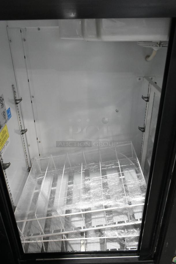 Imbera VRD41 metal commercial 2-door reach-in cooler with poly coated racks, 115 volts, 1 phase. Clean interior view.