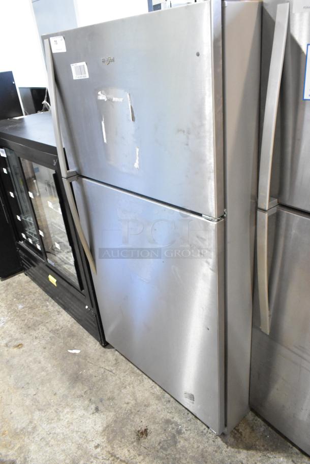2024 Whirlpool WRT311FZDM15 stainless steel fridge with freezer, 115V, 1 Phase. Visible wear on the door surface.