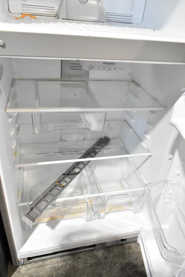 2024 Whirlpool WRT311FZDM15 stainless steel cooler with freezer, 115 volts, 1 phase. Interior shelves and bins visible, clean condition.