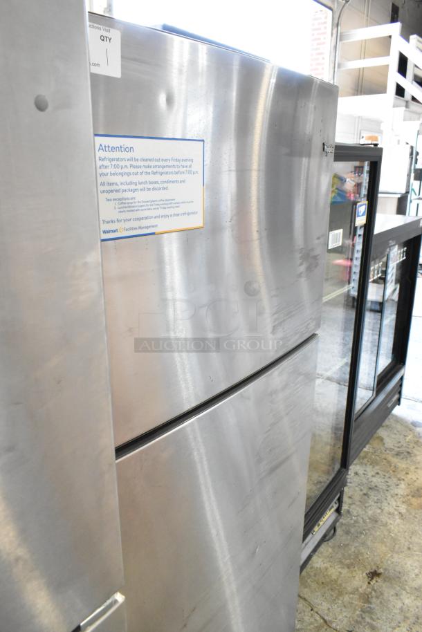 Whirlpool stainless steel cooler with freezer, 115 volts, 1 phase. Visible label details cleaning schedule.