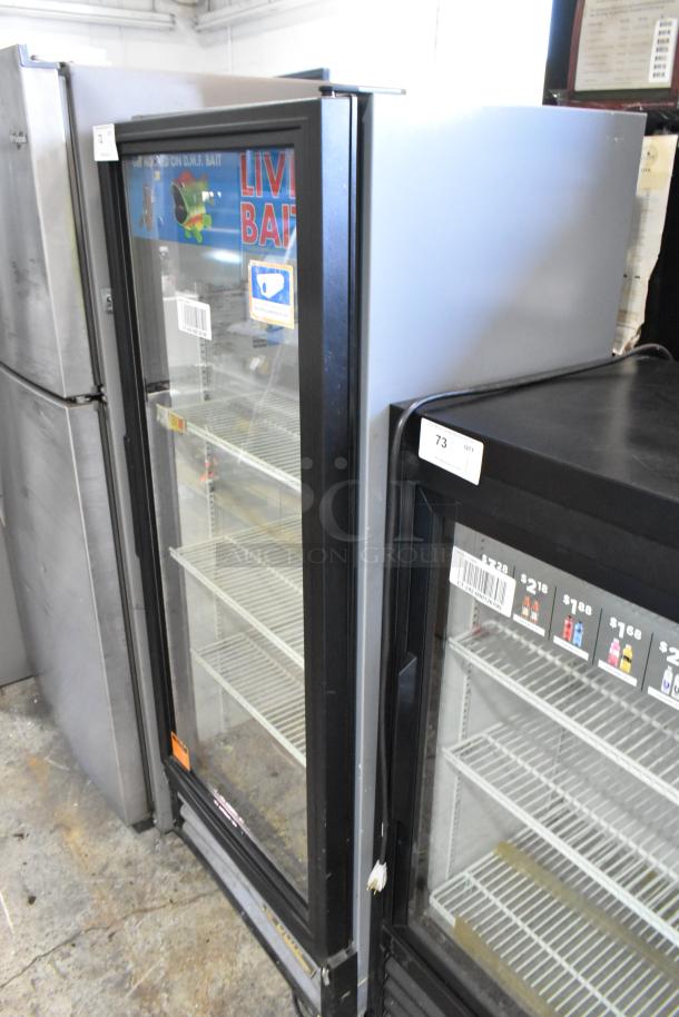 True GDM-12 single door cooler merchandiser with poly coated racks, 115 Volts, 1 Phase, black metal, good condition.