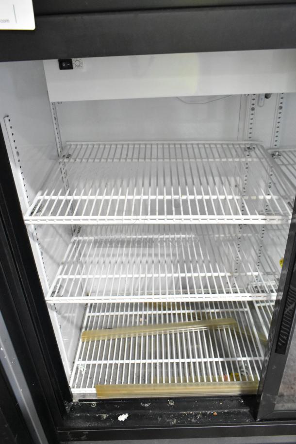 2019 True GDM-41SL-48-HC-LD commercial cooler, 2-door, with poly-coated racks, 115V, condition showing some wear.