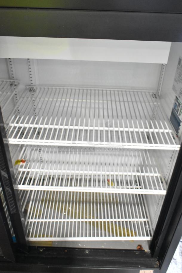 2019 True GDM-41SL-48-HC-LD commercial cooler, 2-door, poly coated racks, 115 volts, lightly stained interior.